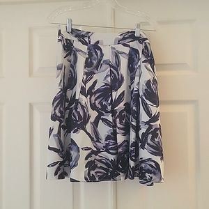 Uniquely patterned flowy, gently pleated, a line skirt